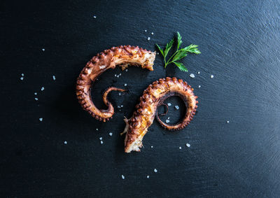 High angle view of bread on table against black background