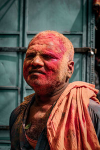 Man with powder paint standing outdoors