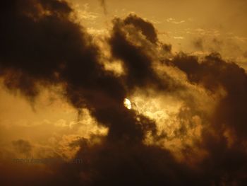 Low angle view of cloudy sky during sunset