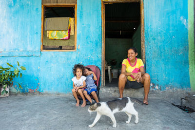 Full length of a dog sitting outdoors