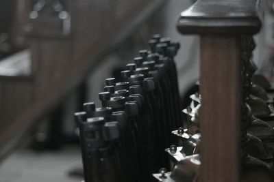 Close-up of rifles arranged indoors