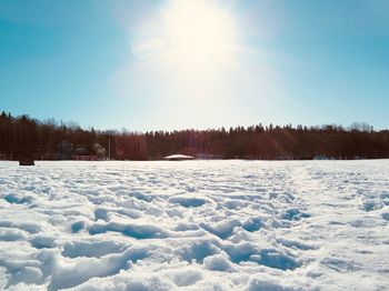 Scenic view of snow field against sky