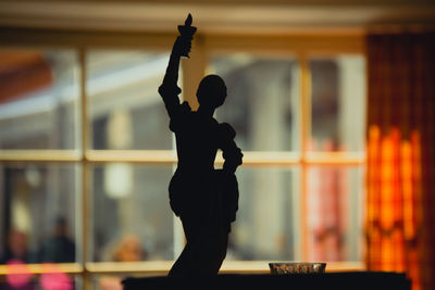 Silhouette man standing at nightclub