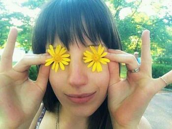 Woman holding white flowers