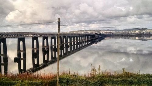 Bridge over river against sky