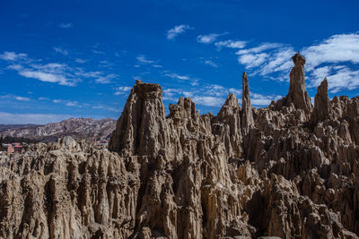 Low angle view of rock formations against sky