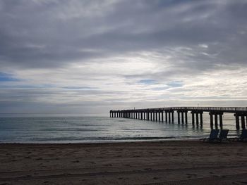 Pier over sea against sky