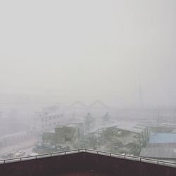 View of city during foggy weather