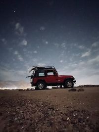 Tractor on field against sky