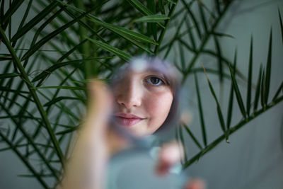 Portrait of young woman in mirror 