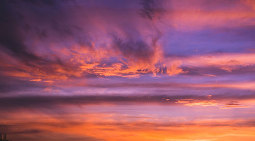 Low angle view of dramatic sky during sunset