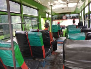 Rear view of people in bus