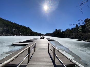 Scenic view of footbridge against sky