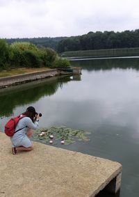 Rear view of women looking at lake