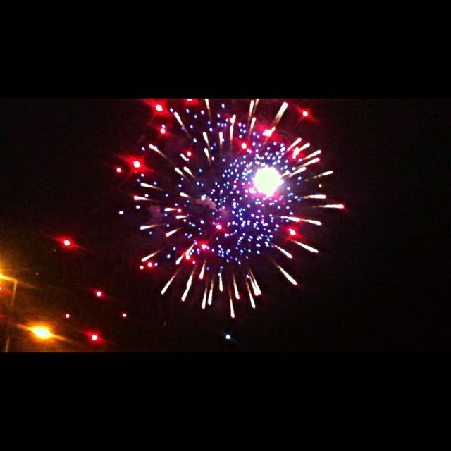 illuminated, night, celebration, glowing, firework display, arts culture and entertainment, exploding, event, long exposure, firework - man made object, motion, sparks, low angle view, lighting equipment, dark, celebration event, fire - natural phenomenon, multi colored, blurred motion, light