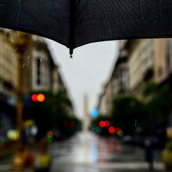 Close-up of wet road during rainy season