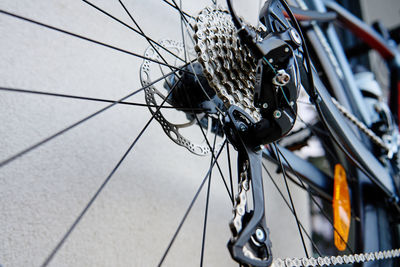 Shifting gears on rear transmission of bicycle. bicycle gear drivetrain and cassette, close up