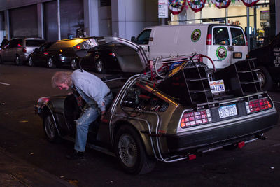 Vehicles on road in city at night