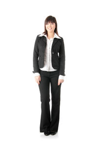 Portrait of a smiling young woman against white background