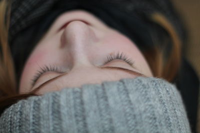 Young woman with eyes closed