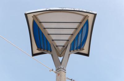 Low angle view of metallic structure against clear blue sky