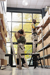 Rear view of man standing in office