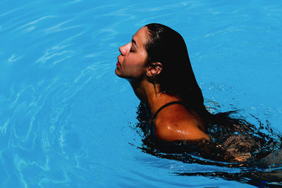 Close-up of woman in swimming pool