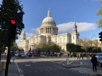 View of city street and buildings against sky