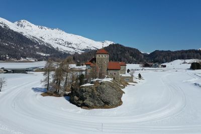 Scenic view of snow covered mountain against clear sky