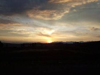 Scenic view of silhouette landscape against sky during sunset