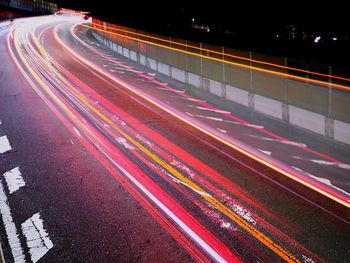 High angle view of light trails on road at night