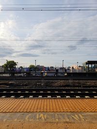 Train at railroad station against sky