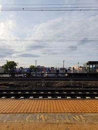 Train at railroad station against sky