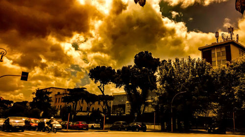 View of road against cloudy sky at sunset