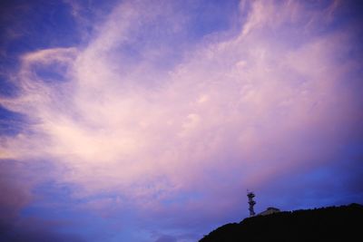 Low angle view of silhouette trees against sky at sunset