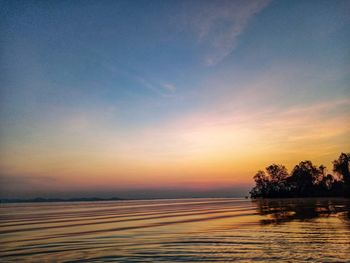 Scenic view of silhouette trees against sky during sunset