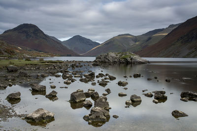 Scenic view of lake and mountains against sky