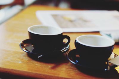 Close-up of coffee cup on table