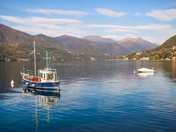 Boats in sea against sky