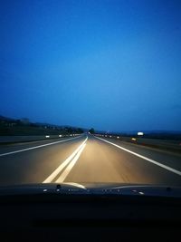 Road seen through car windshield