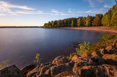 Scenic view of lake at sunset