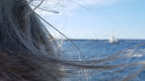 Close-up of woman against sky