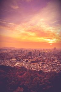 Cityscape against sky during sunset