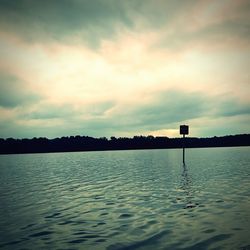 Scenic view of river against sky during sunset