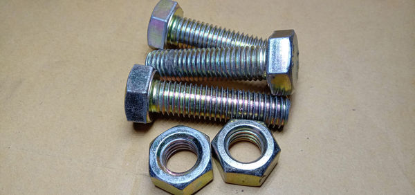 High angle view of metallic equipment on table