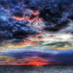 Dramatic sky over sea during sunset