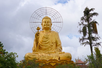 Low angle view of statue against sky during sunset