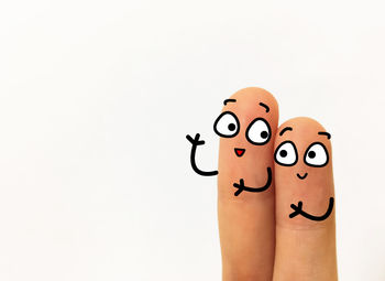 Close-up of human hand against white background