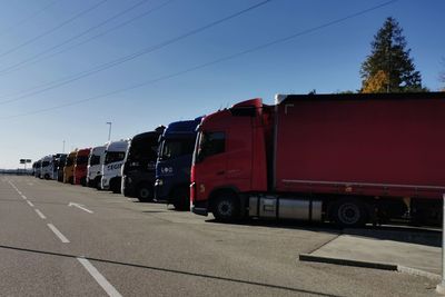 Train on road against blue sky