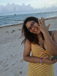 Portrait of smiling young woman on beach